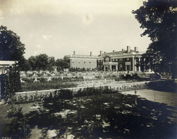 Exterior view of the north front of Wadsworth Hall. A large garden is visible in the foreground.