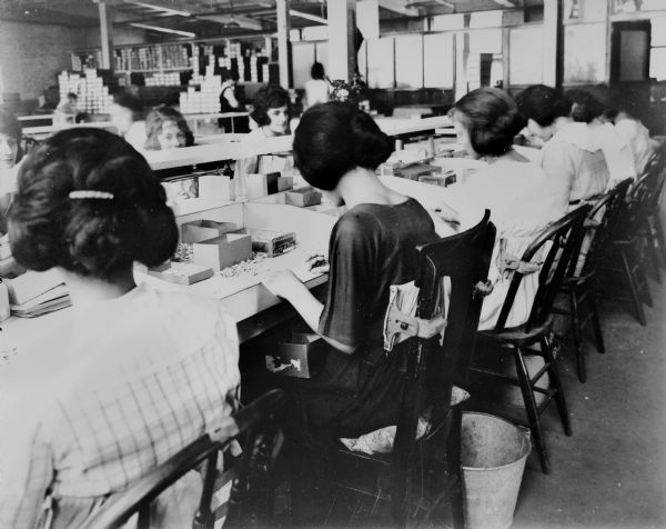 Women shown working inside the La Crosse business.