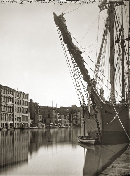 Schooners docked on river. The view is downriver from the Grand Avenue Bridge.