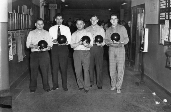 The Local 1131 UE Winders bowling team at the Milwaukee County Bowling Tournament. From left to right are Chester Chojnacki, Louis Mersho, team captain Carl Schlinke, Earl Gielow and Milt Riemann.