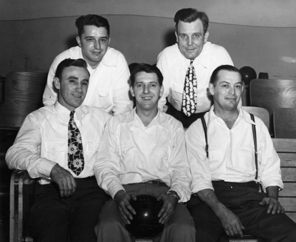 Team portrait of the Heil Local 1344 Social League "Truck Tanks" bowling team. From left to right are Ray Werra, team captain Tony Lidwin, George Karolowski, Ben Schwacher, and Emil Kostrzewa.