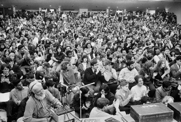 A crowd of over 1000 students attend a 10-hour teach-in against the war in Vietnam. The teach-in was conducted by 25 faculty members in the University of Wisconsin-Madison Social Science Building.