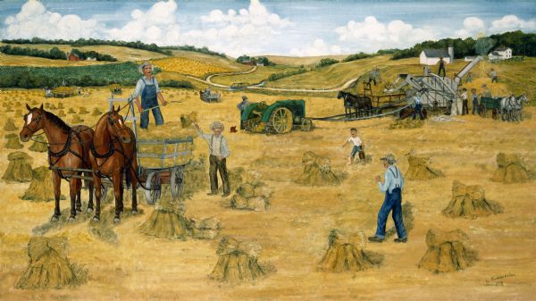 A threshing scene during harvest time. In the background, the separater tender stands on the thresher overseeing the whole operation. He has a weighing device in front of him. Teams of horses pull bundle wagons as men work throughout the field.