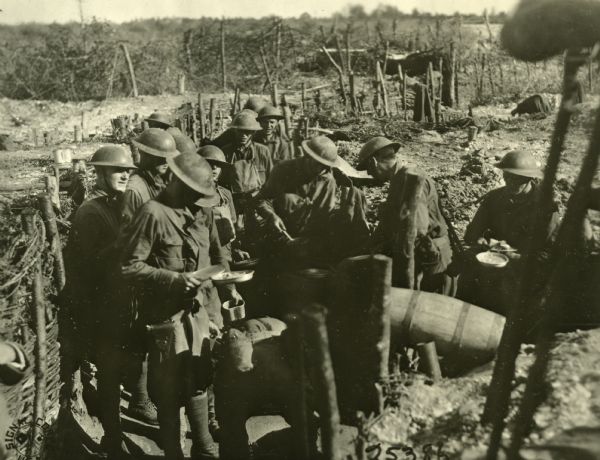 Infantry men receiving food in outpost, Front Line on Piave Front, Italy.