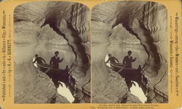 Stereograph of two men in a canoe looking out from Boat Cave. Text at right: "Wanderings Among the Wonders and Beauties of Wisconsin Scenery."