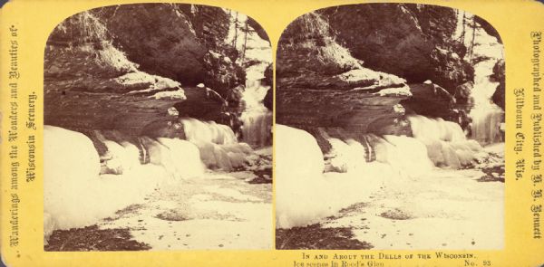 Stereograph of winter scene in Rood's Glen covered with ice and snow. Text at left: "Wanderings Among the Wonders and Beauties of Wisconsin Scenery."