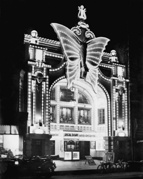 Exterior view at night of the Butterfly Theater, 212 West Wisconsin Avenue, from the street. Early advertisements proclaimed it to be "Milwaukee's movie palace." The Butterfly was in operation from 1911 to 1930.
