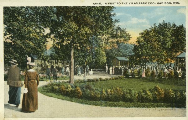 Early souvenir postcard showing people strolling around the grounds of the recently-opened Vilas Park Zoo (Henry Vilas Zoo). Caption reads: "A Visit to the Vilas Park Zoo, Madison, Wis."