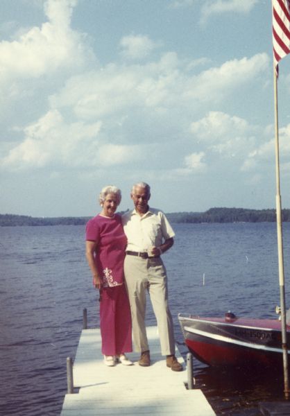 Informal portrait of Sigurd and Elizabeth Olson standing on a pier.