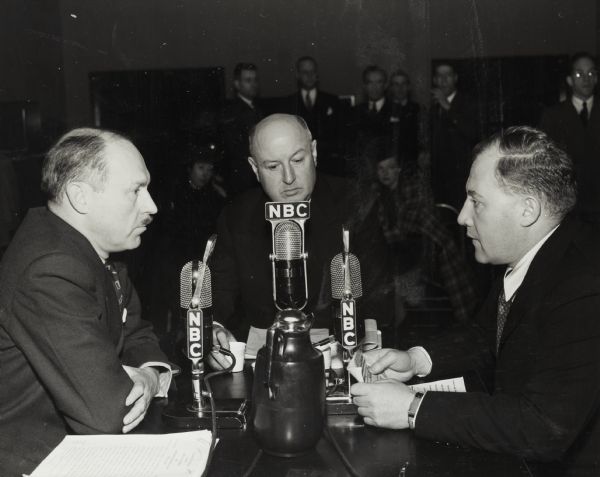 Drew Pearson (left), and Robert S. Allen (right), whose syndicated column "Washington Merry Go Round" made them among the nation's best known journalists. In addition to their newspaper column they also had a regular radio program, and here they are interviewing James A. Farley.