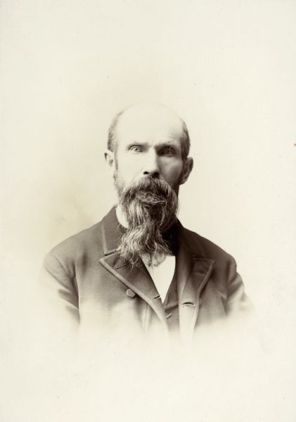 Vignetted carte-de-visite portrait of Ole Torgerson on his 70th birthday.