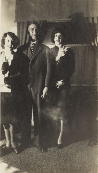 The Sidell Sisters pose on either side of August Sidell (Uncle Sid). From left to right are Pierre Sidell, August Sidell and Violet (Billie) Sidell.