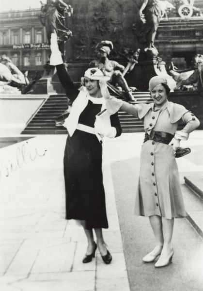 Billie (left) and Pierre Sidell outdoors in Europe (possibly Germany?), in fashionable attire.