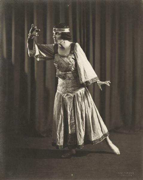 Leo Kehl performs a dance, costumed as a woman.
