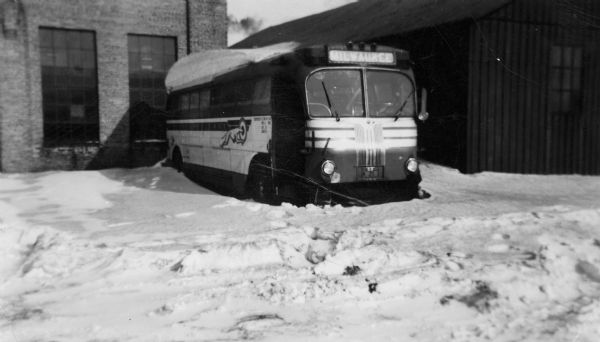 A Greyhound Cruiser is parked in the snow, waiting for parts at the Greyhound station on Brearly Street where Lewis Arms was employed. Arms called this one "my second favorite bus."