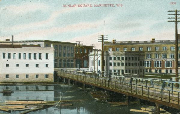 Colorized view across a river toward Dunlap Square. A bridge is on the right. Caption reads: "Dunlap Square, Marinette, Wis."