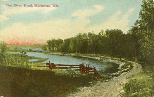 Colorized view of a road along a river. Caption reads: "The River Road, Marinette, Wis."