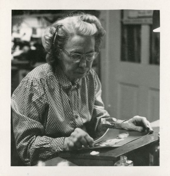 Close-up of Miriam Bennett working on a photographic print at the Bennett studio.  Possibly taken by Ruth Bennett Dyer or Oliver Reese.