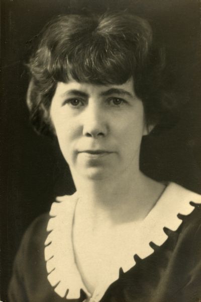 Quarter-length studio portrait of Miriam Bennett wearing a white notched collar. Possibly taken by Evaline Bennett or Ruth Bennett Dyer.