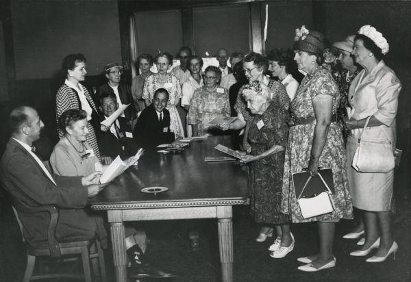 Leslie H. Fishel, Jr. with a group of mostly women. He was the Director of the State Historical Society of Wisconsin from 1959 until 1969.