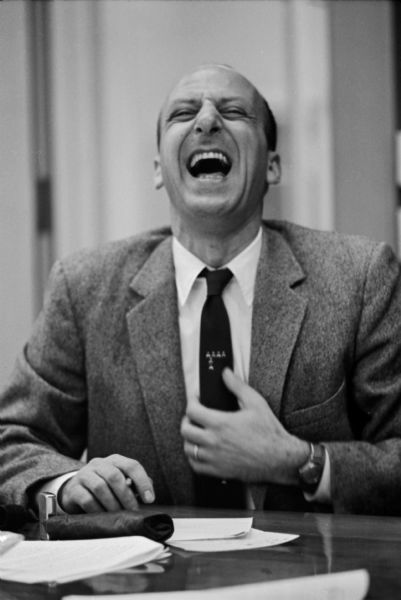 Portrait of Leslie H. Fishel, Jr., laughing, at the State Historical Society of Wisconsin. He was the Director of the State Historical Society of Wisconsin from 1959 until 1969.