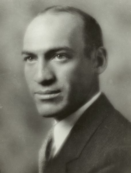 Quarter-length studio portrait of Harold M. Groves.