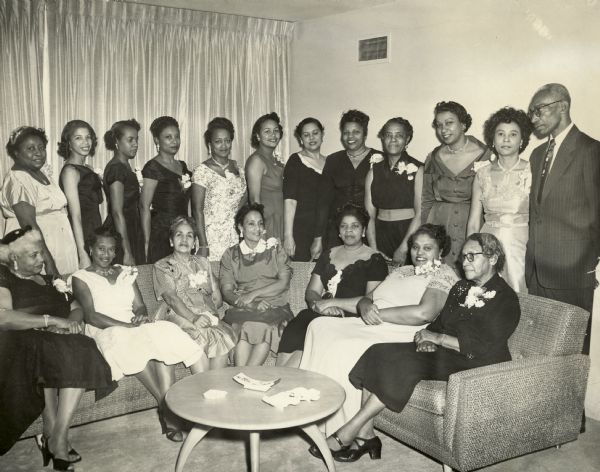 A women's group poses with Daisy and L.C. Bates, who are standing at the far right of the group.