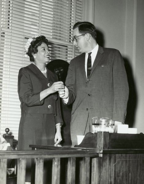 Daisy Bates accepts a gavel from The Honorable Edward F. McGlaughlin, president of the Boston City Council. She had just spoken before the Council.
