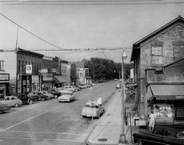 Elevated view looking east on Hubbard Street from the corner of Hubbard and Parmenter Streets. 

The old Schwab and Scwarz store, in the oldest building in Middleton, is on the right.