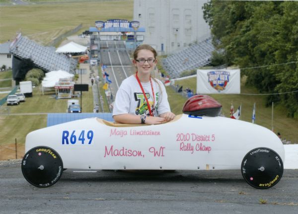 Portrait of Maija Liimatainen of Monroe, Wisconsin with her soap box derby car posed on the racing hill at Derby Downs, Akron, Ohio. Maija won the super stock competition at the All-American Soap Box Derby in 2009.  In 2010 she competed in Akron as the District 5 Rally Champ, but did not place at the national race.