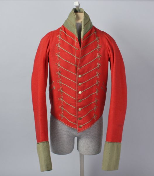 This is a red United States (U.S.) militia cavalry uniform coat. It is mounted on a mannequin form.