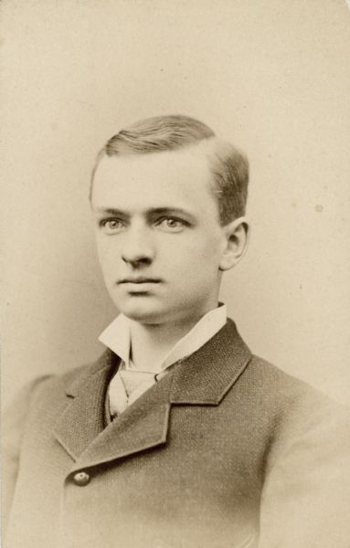 Quarter-length studio portrait of Edmond Burdick as a young man.