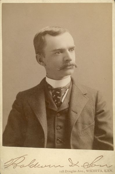 Quarter-length studio portrait of Edmond S. Burdick.