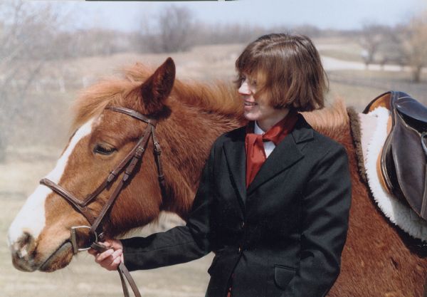 Loraine Adkins of Madison, Wisconsin ready to participate with the Hoofbeat Ridge Drill Team of Mazomanie at the Midwest Horse Fair in the spring of 1992 or 1993.
