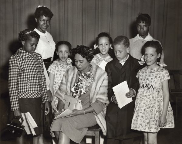 Daisy Bates signs autographs for school children who attended the Freedom Rally at Memorial High School where Bates, "the First Lady of Little Rock," was a speaker.