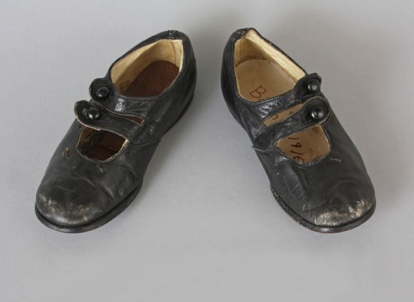 Boy's black leather shoes with double straps. They were made in 1884-1885.