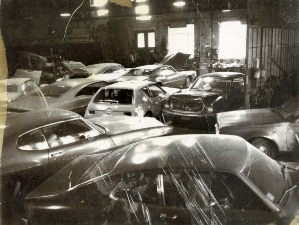 Elevated view of cars inside the Ideal Body Company on Park Street.