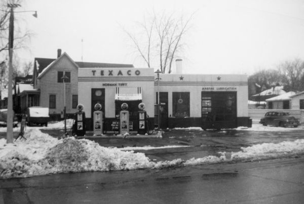 View from street of exterior of the Texaco station on Park Street owned by Norman Tifft.
