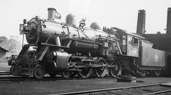 Left side view of locomotive engine no. 2630, a steam locomotive of the Chicago, Milwaukee, St. Paul and Pacific Railroad Company.