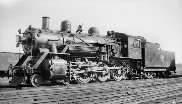 Left side view of locomotive engine no. 2871, a steam locomotive of the Chicago, Milwaukee, St. Paul and Pacific Railroad Company.