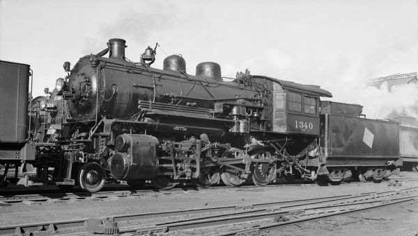 Left side view of locomotive engine no. 1340, a steam locomotive of the Chicago, Milwaukee, St. Paul and Pacific Railroad Company.
