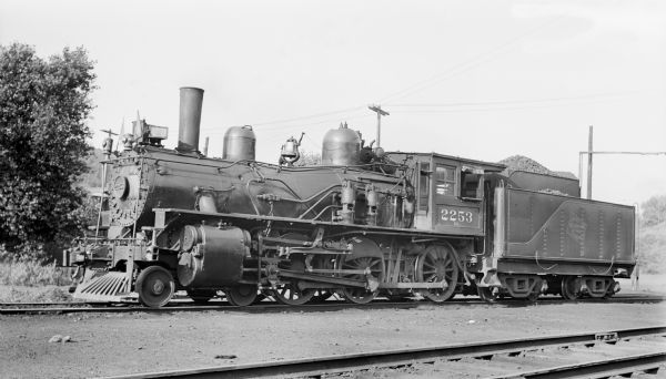 Left side view of locomotive engine no. 2253, a steam locomotive of the Chicago, Milwaukee, St. Paul and Pacific Railroad Company.