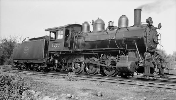 Right side view of the engine no. 1277, a steam locomotive of the Chicago, Milwaukee, St. Paul and Pacific Railroad Company.