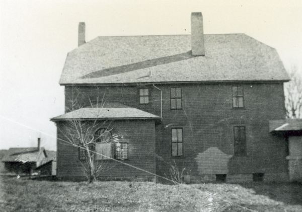 Rear elevation of the West Cottage Hillside Home School, the school run by Ellen and Jane Lloyd Jones, aunts of architect Frank Lloyd Wright. In 1902 Wright designed an addition for the school which was connected to this building by a one-story walkway. This connection can be seen in the lower right of the image.