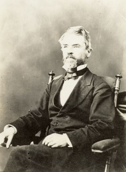 Formal portrait of Increase Lapham sitting in a chair.