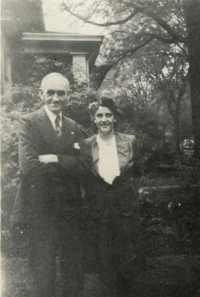 Charles E. Brown and his wife Dorothy Miller standing outside their home at 2011 Chadbourne Avenue.