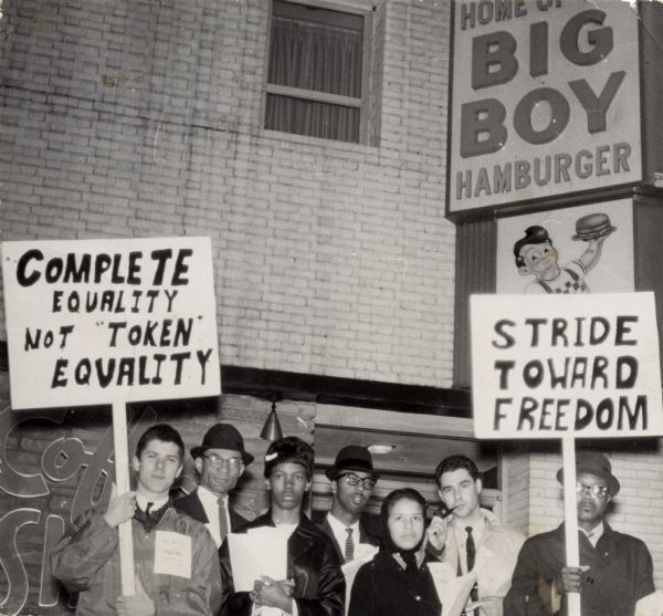 Group of people, probably including NAACP Youth Council members, picketing outside Marc's Big Boy restaurant. Lloyd Barbee is second from the left.