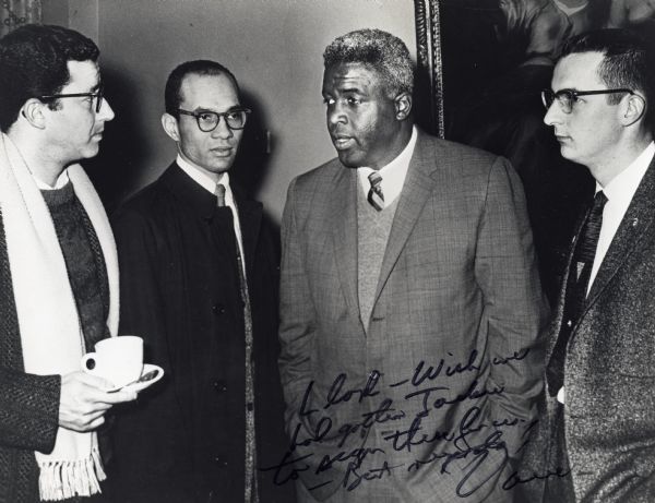Stanley Zuckerman, Lloyd Barbee, Jackie Robinson, and David Obey. The photograph is inscribed from Obey to Barbee.