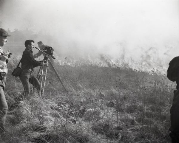 Disney film crew in UW-Madison Arboretum's Curtis Prairie filming a prescribed burn.