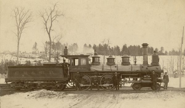 Side view of the Chicago, Milwaukee & St. Paul Railway engine no. 207, a yard engine.